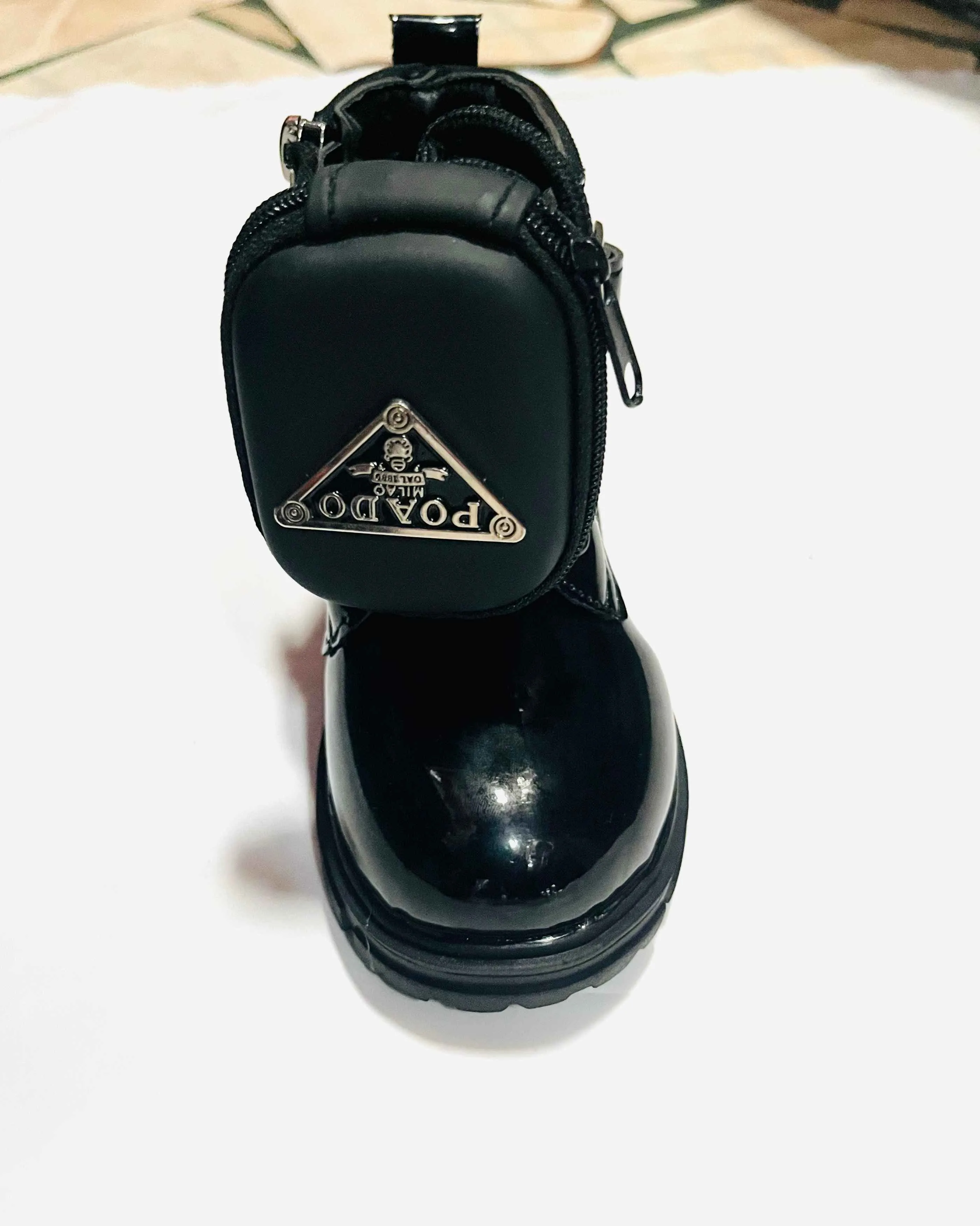 Black boot with mini bag/pouch detail