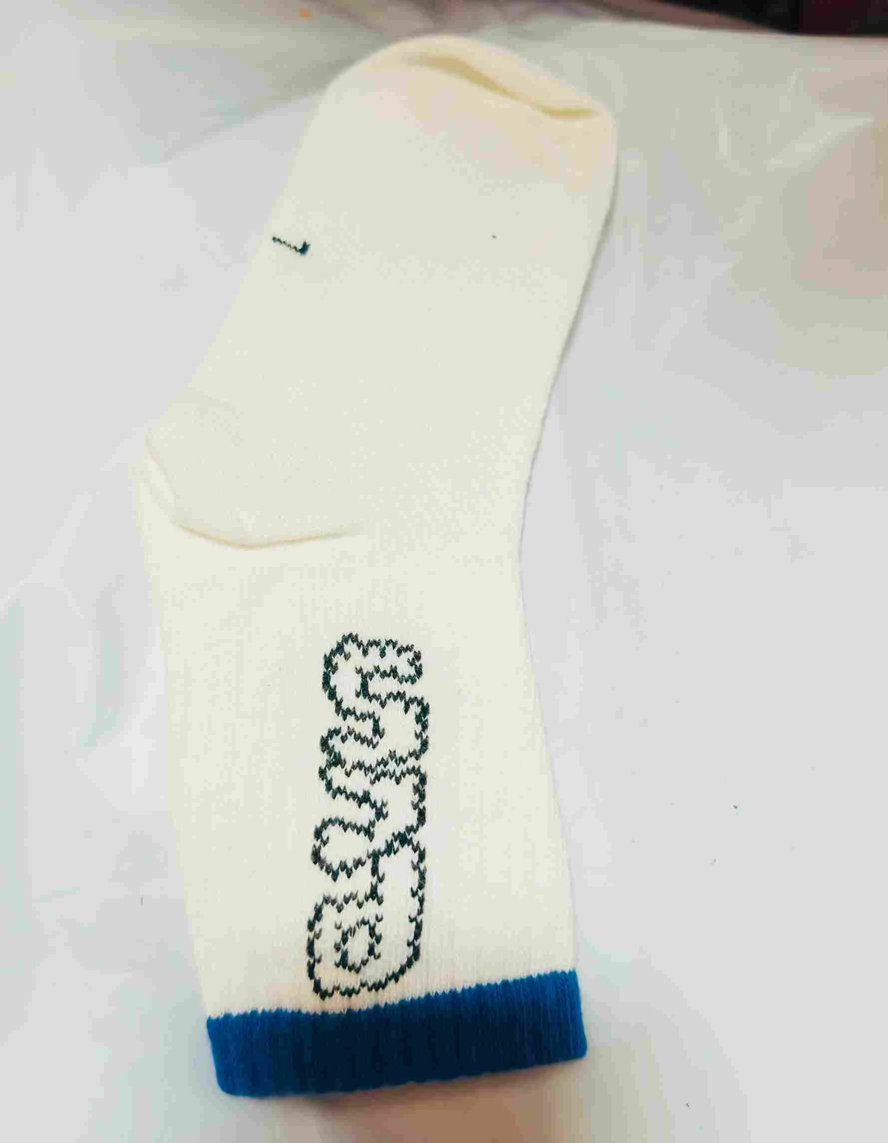 Cream/white socks with text & blue trim